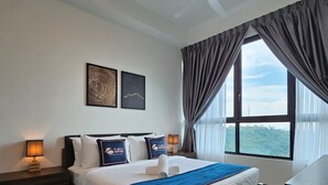 A hotel room with a bed, two bedside lamps, a window with curtains, and two framed artworks on the wall. - Cubic Botanical Premium Suites atBangsar (Kuala Lumpur)