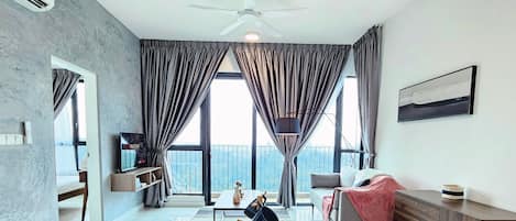 Exclusive Suite | Living area | Flat-screen TV