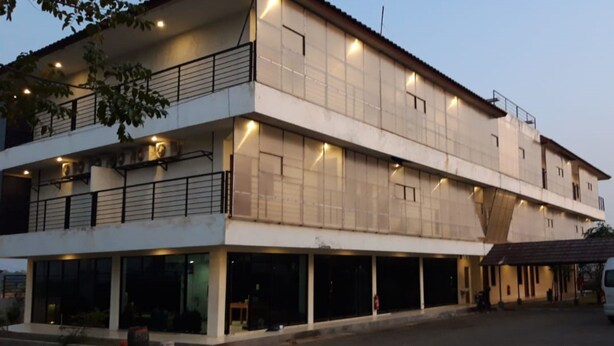 A two-story building with a flat roof, large windows, and a covered entrance area. - Hotel O Aulia Residence (Rembang)