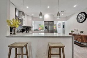 Fridge, microwave, oven, stovetop - Tradewinds: Ultimate Delray Beach Lifestyle 3BR2BA Home + Heated Pool (Delray Beach)