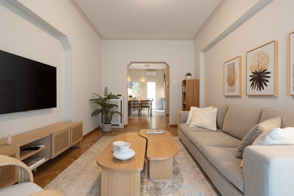 Design Apartment | Living area | 49-inch Smart TV with cable channels