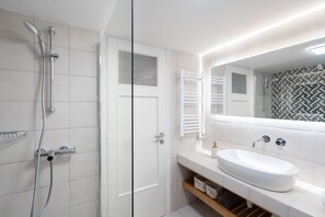 Design Apartment | Bathroom | Shower, rainfall showerhead, hair dryer, towels