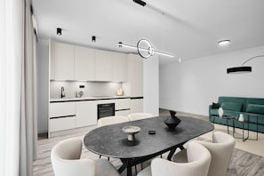 Two-Bedroom Deluxe Apartment with Balcony | Living area | 55-inch Smart TV with digital channels, Netflix, first-run movies - Collect Residence (Budapest)