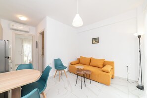 Apartment, 1 Bedroom | Living area | Flat-screen TV