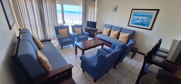 Standard Apartment | Living area | 32-inch flat-screen TV with satellite channels