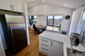 Fridge, microwave, oven, stovetop - Beach House with Sea Views and a Large Backyard (East Devonport)