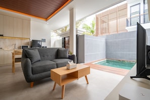 Standard Villa | Living area | 43-inch Smart TV with cable channels