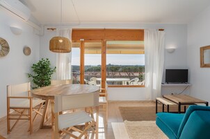 Superior Apartment | Living area | 20-inch TV with cable channels