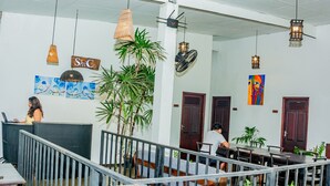 A spacious lobby with a reception desk, a staircase, and a dining area. - ShiCo Transit Hotel (Seeduwa - Katunayake)
