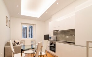 Basic Apartment, 1 Bedroom, Balcony | Living area | 30-inch TV with digital channels - Duomo Urban Retreat by Wonderful Italy (Milan)
