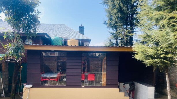 A small building with a flat roof, a brick wall, and a window. - Silver Oak (Srinagar)