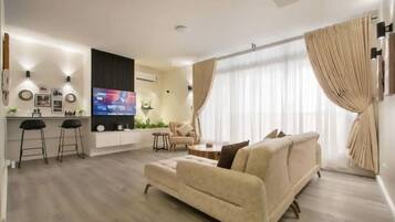 Luxury Apartment | Living area | 52-cm Smart TV with cable channels, Netflix, Hulu