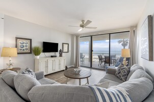 Signature Condo, 3 Bedrooms, Balcony, Beach View | Living room | 50-inch Smart TV with cable channels
