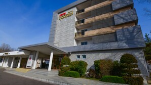 A modern hotel with a prominent "HOTEL MODERN" sign, a multi-story structure, and a covered entrance area. - Complex Modern Mamaia All Inclusive (Constanta)
