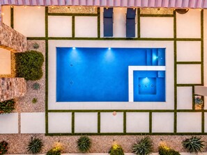 A rooftop pool with a smaller adjacent hot tub, surrounded by a geometric garden layout. - Golfers' Paradise: Pool, Spa, EV Charger (La Quinta)