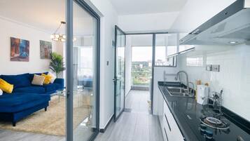 Deluxe Apartment | Living area | Smart TV