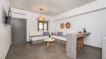 Superior Suite | Living area | 52-inch flat-screen TV with satellite channels