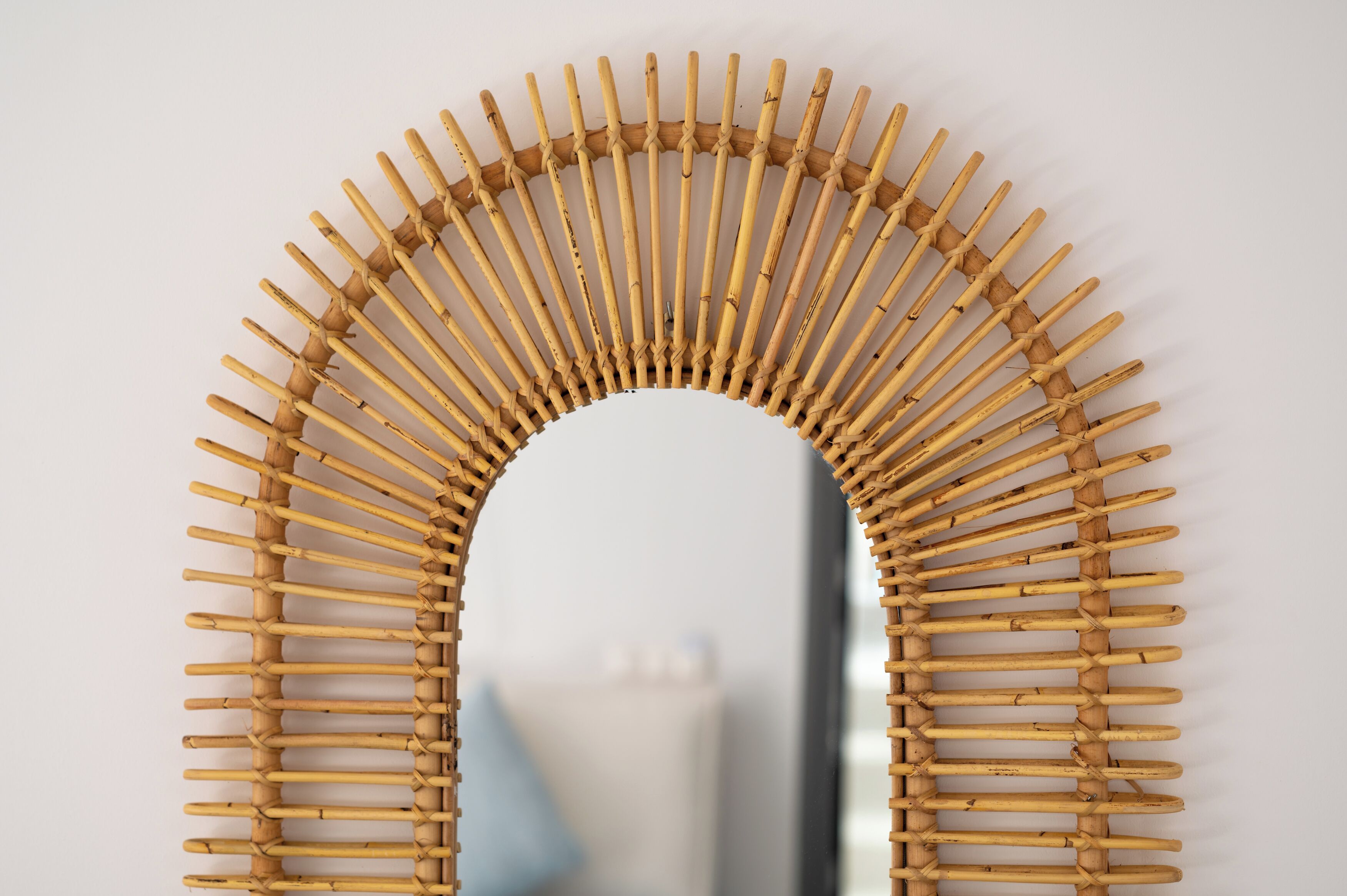 A wall-mounted bamboo arch structure.