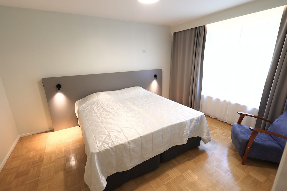 1 bedroom, desk, laptop workspace, bed sheets