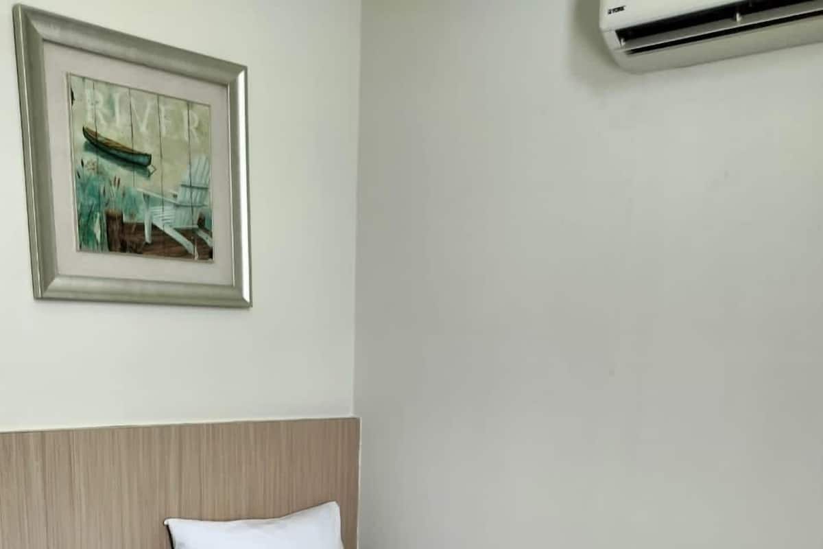 Premium bedding, desk, laptop workspace, free WiFi
