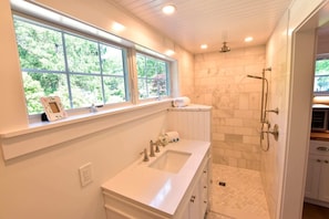 Shower, hair dryer, towels, shampoo