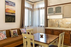 Deluxe Studio, 1 King Bed with Sofa bed, Private Bathroom | Living area | 32-inch Smart TV with cable channels - The Owl House (Chania)