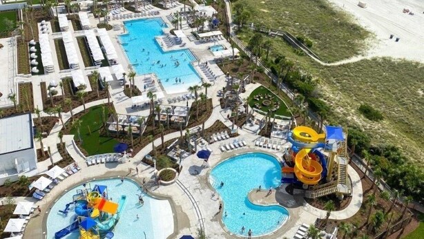 A resort with multiple swimming pools, a water park, and a beach area. - 1606 Brighton 3 Bedroom Condo (Myrtle Beach)