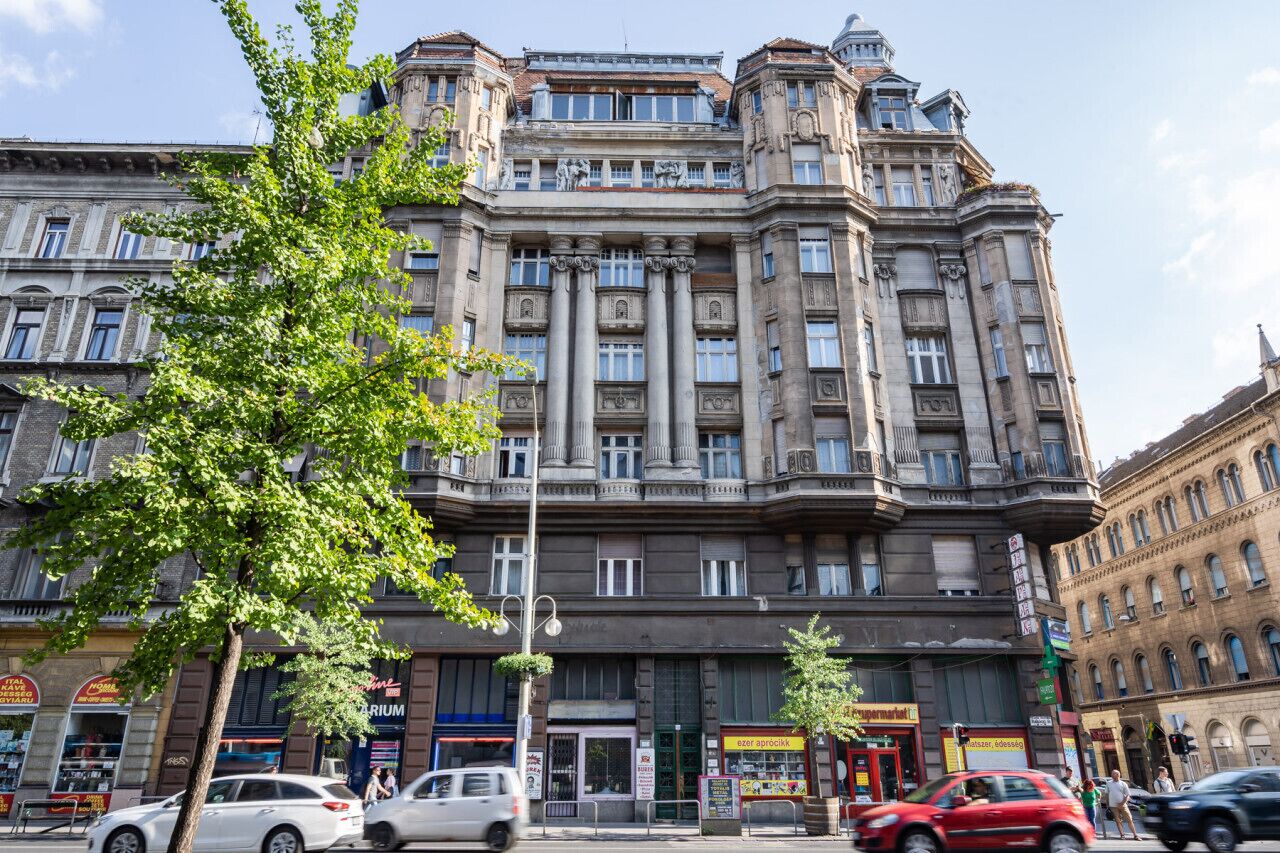 A historic building with classical architecture, featuring multiple floors, large windows, and a prominent entrance.