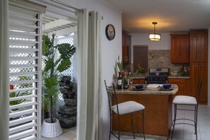 Classic Cottage, 3 Bedrooms, Kitchen, Garden View | Private kitchen | Full-size fridge, microwave, oven, dishwasher - Alamanda Cottage at Serenity (Montego Bay)