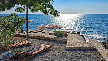 Private beach nearby, black sand, sun-loungers, beach umbrellas