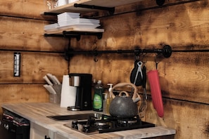 Fridge, stovetop, coffee/tea maker, cookware/dishes/utensils