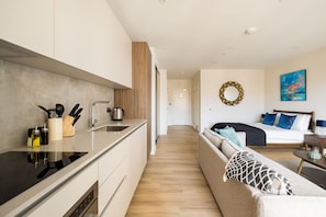 Superior Studio | Private kitchen | Full-size fridge, microwave, oven, stovetop