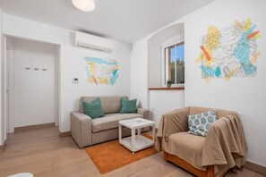 Living area -  2 bedroom App only steps away from the beach (Ika)