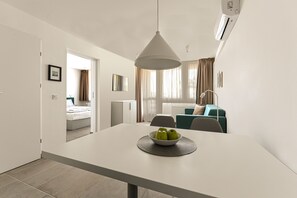 Deluxe Apartment, Balcony | Living area