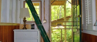 Beautiful open-concept log home in quiet setting on Thompson Lake.