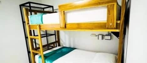 A bunk bed with a wooden frame and a single mattress.