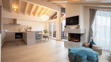 Etoile Penthouse Luxury Apartment Matterhorn View | Living area | 50-cm flat-screen TV with cable channels, fireplace, printers