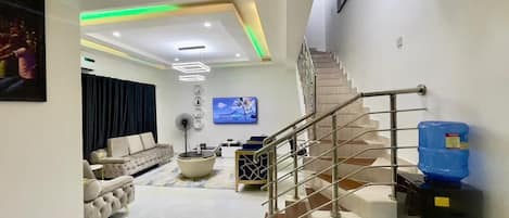 Luxury Duplex, Courtyard View | Living area | 65-inch LED TV with digital channels, video-game console, Netflix