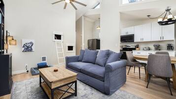 Condo, Multiple Beds, Balcony, Garden View (The Snuggly Otter) | Living area | 50-inch flat-screen TV with digital channels, fireplace