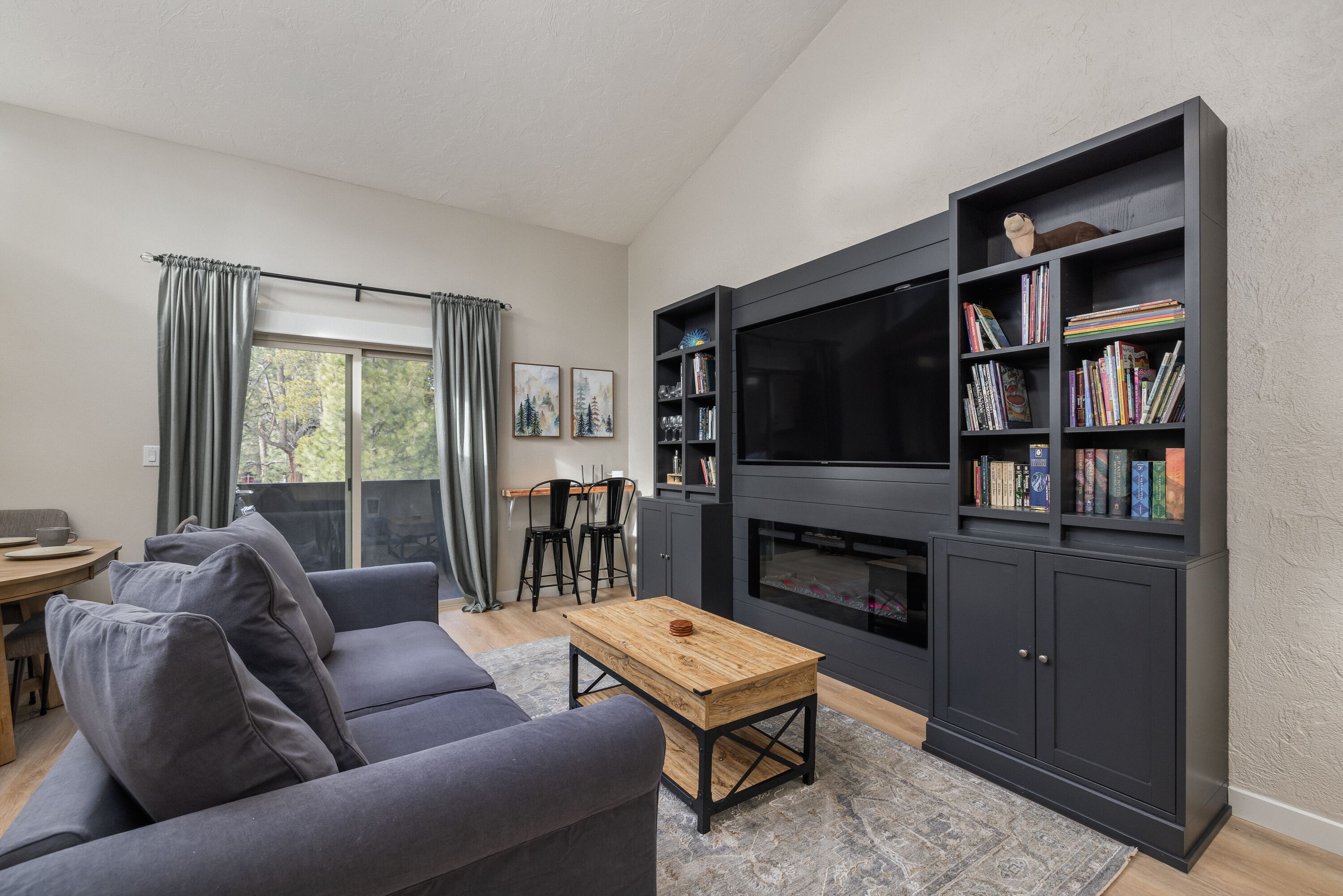 Condo, Multiple Beds, Balcony, Garden View (The Snuggly Otter) | Living area | 50-inch flat-screen TV with digital channels, fireplace