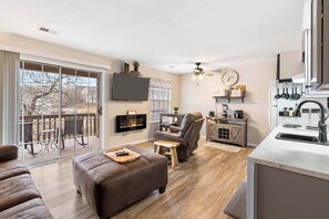 Condo, 1 King Bed with Sofa bed, Balcony (Chandler’s Pondview Getaway) | Living area | 42-inch flat-screen TV with digital channels, fireplace