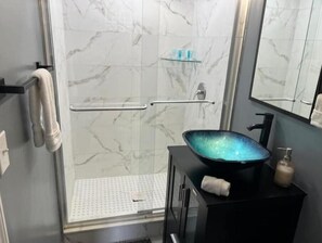 Shower, hair dryer, towels, soap