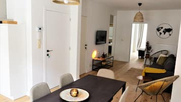 Apartamento conforto | Área de estar | TV