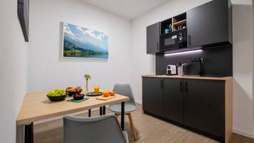 Apartment, Private Bathroom (Deluxe) | Shared kitchen | Full-size fridge, microwave, eco-friendly cleaning products