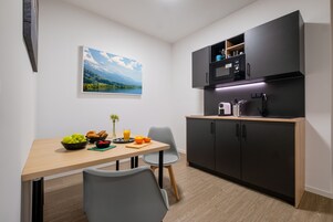 Apartment, Private Bathroom (Deluxe) | Shared kitchen | Full-size fridge, microwave, eco-friendly cleaning products