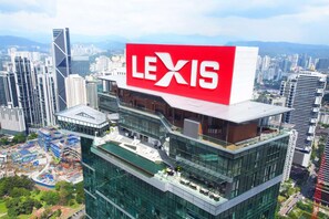 A modern building with a large red sign reading "LEXIS" on top. - Imperial Lexis Kuala Lumpur (Kuala Lumpur)