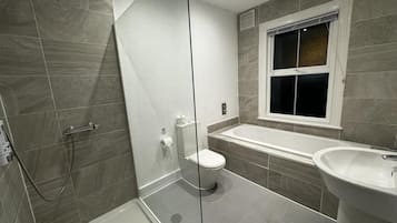 Apartment | Bathroom | Separate bathtub and shower, deep-soaking bathtub, towels, toilet paper