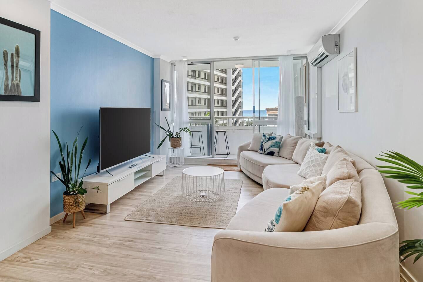 Sliding glass doors from the living area open out to the private balcony and offer glimpses of the glistening ocean. 
