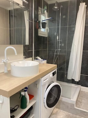 Shower, hair dryer, towels, soap