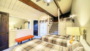A bedroom with two beds, a bench, a ceiling fan, and a staircase leading to another room. - Mountain Getaway Retreat - 4br + loft  (Beech Mountain)